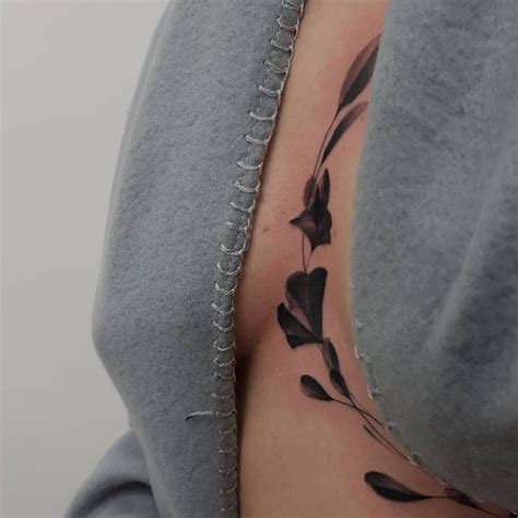 sternum between breast tattoos|Between breast tattoo